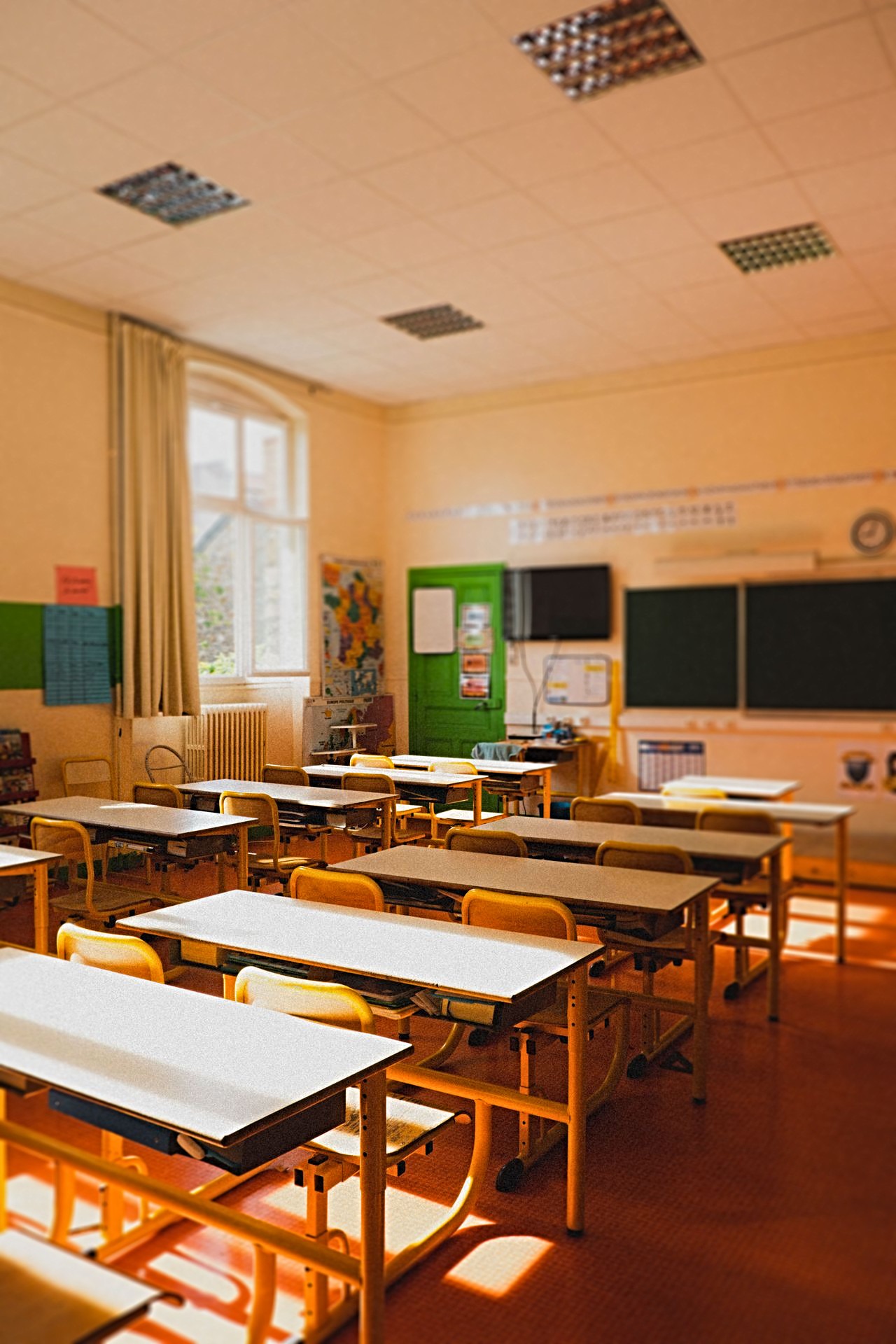 empty Empty classroom with desks and chalkboard